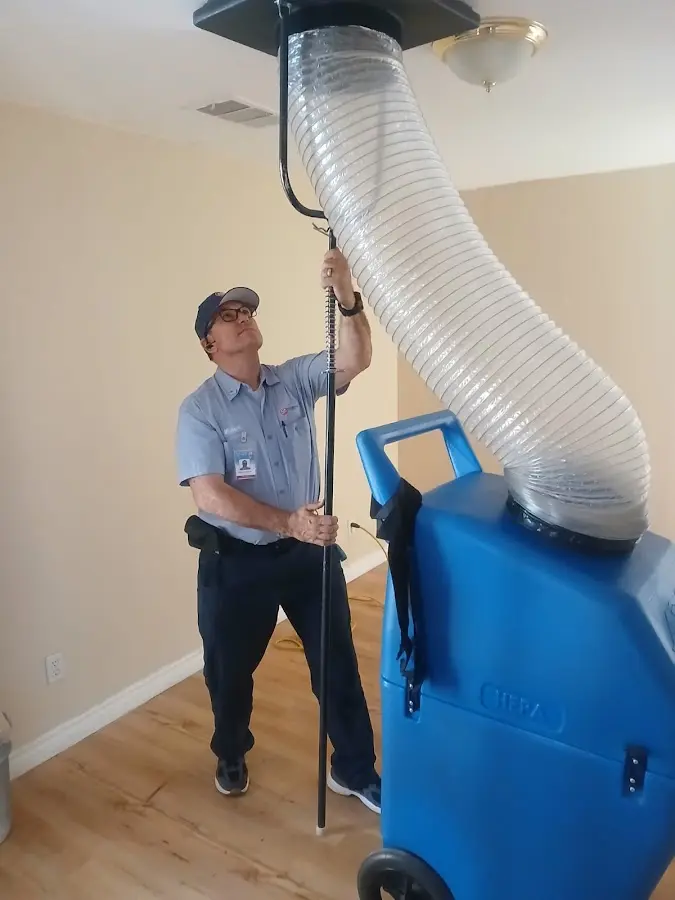 Furnace Tune-Up technician using HEPA equipment in Liberty Hill